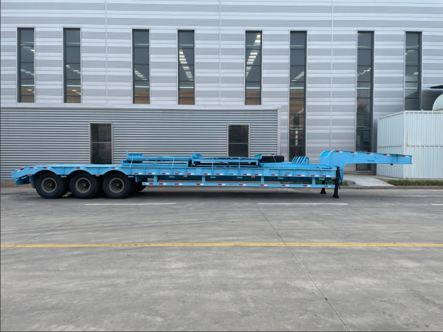 A blue three-axle lowbed semi-trailer with a 50-ton payload ordered by a Nigerian customer.